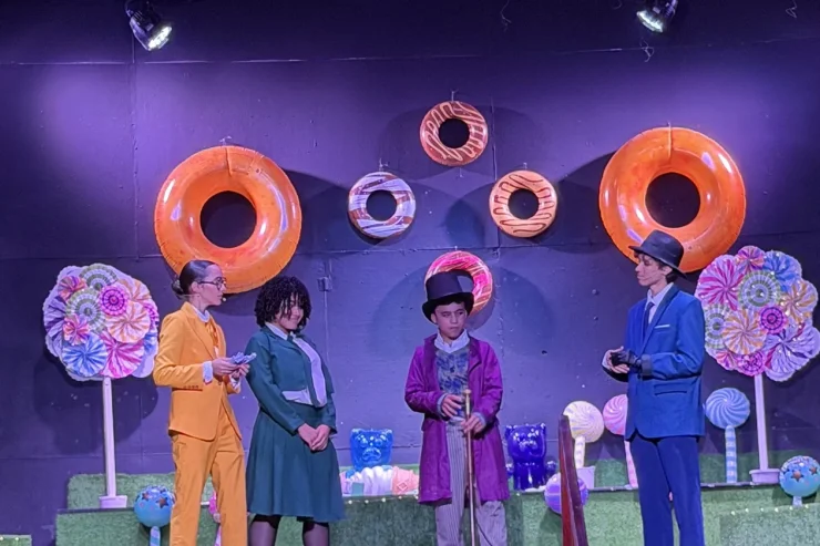 MBS students performing Willy Wonka on the school stage