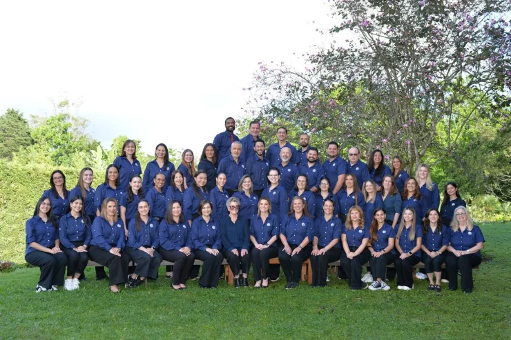 MBS faculty and staff group portrait on the campus lawn