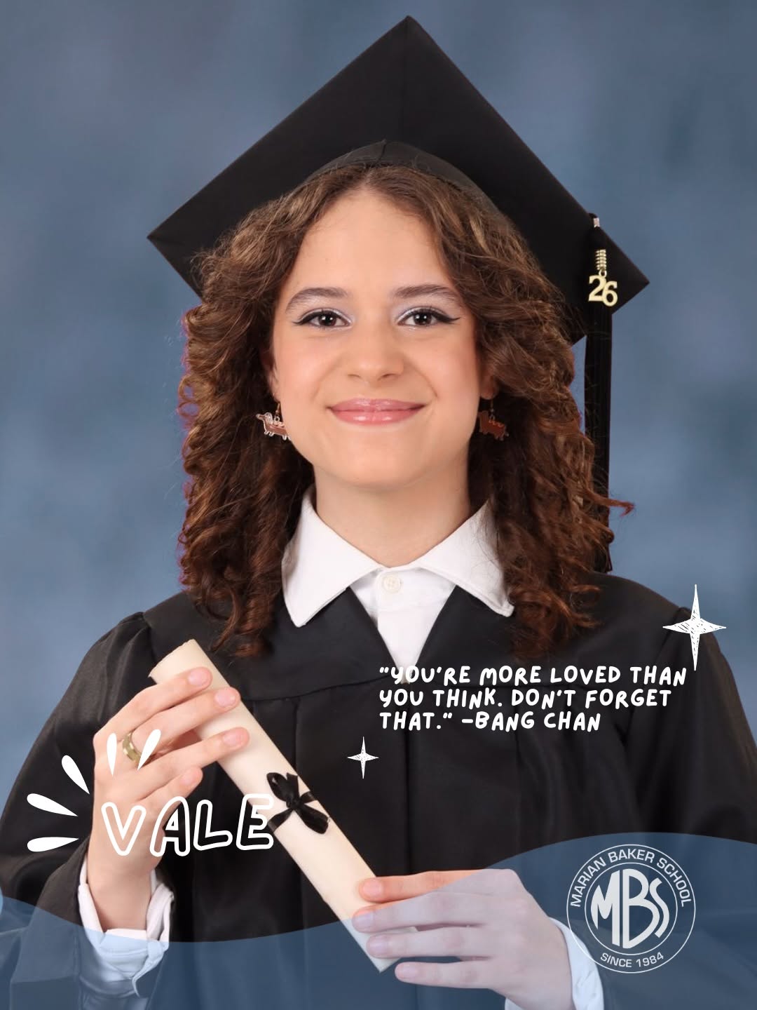 Vale, Marian Baker School Class of 2026 graduate, holding her diploma