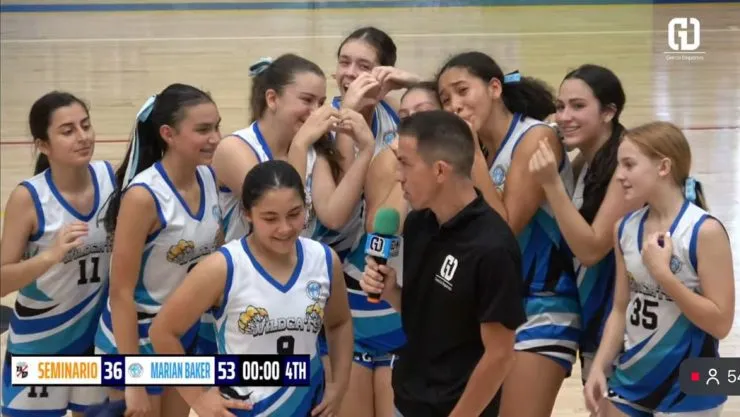Marian Baker School girls' basketball players celebrating their 3rd place finish