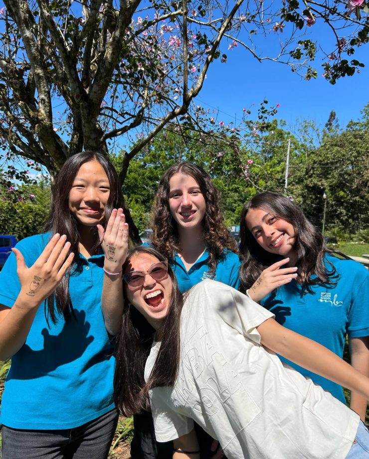 Four Marian Baker School students celebrating after voting in the student council elections